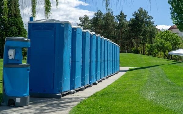 Portable handwashing station with soap dispenser in an outdoor setting